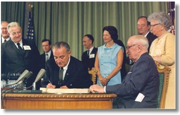 President Johnson signs SS Bill 1965 Courtesy JFK Presidential Library