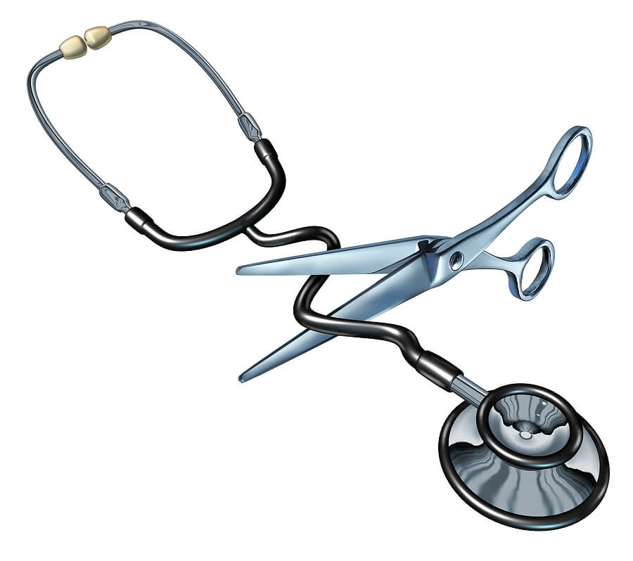 Photo of a scissor cutting the hose section of a stethoscope.